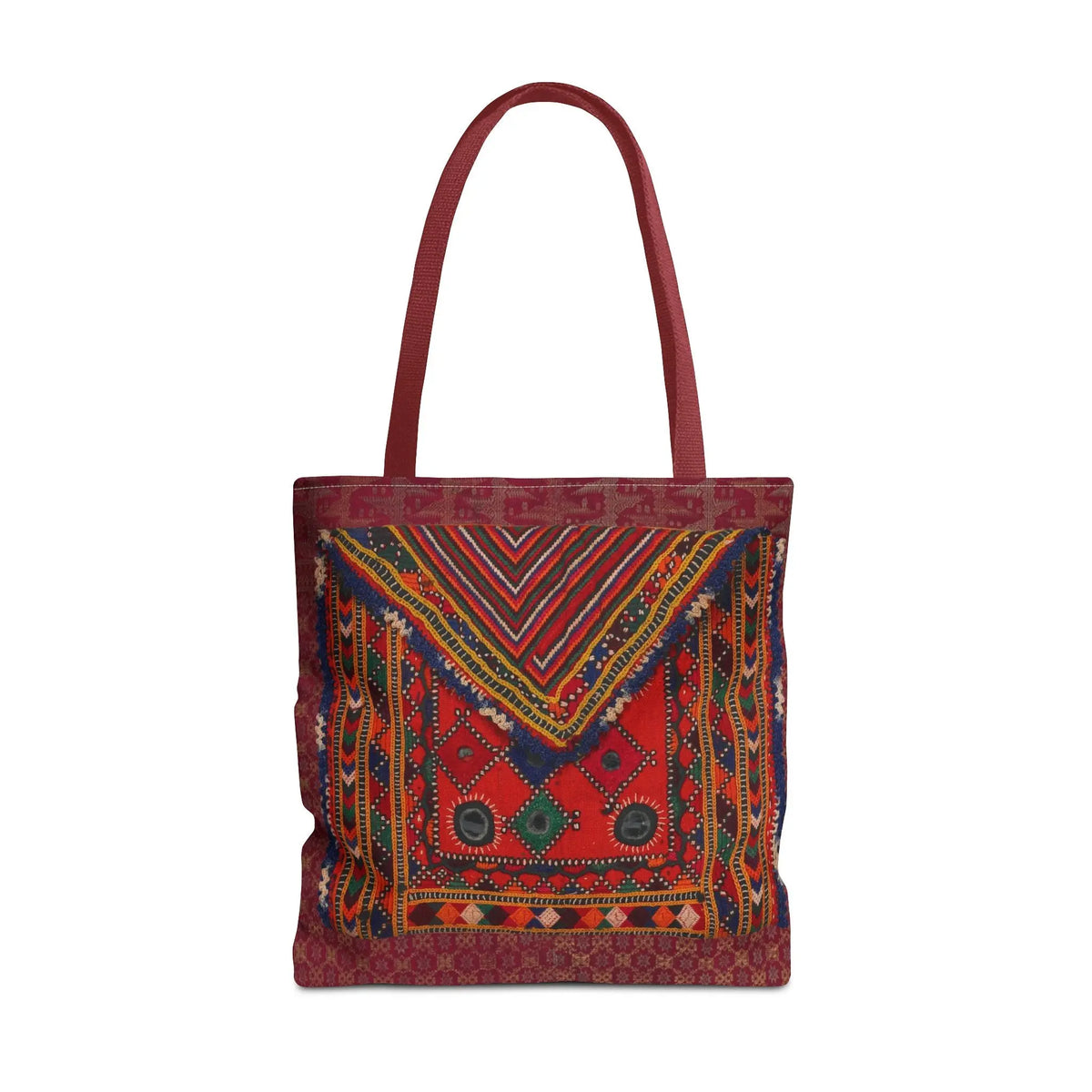 Bohemian vintage Kilim tote bag with red tribal geometric patterns and matching red handles on a white background.
