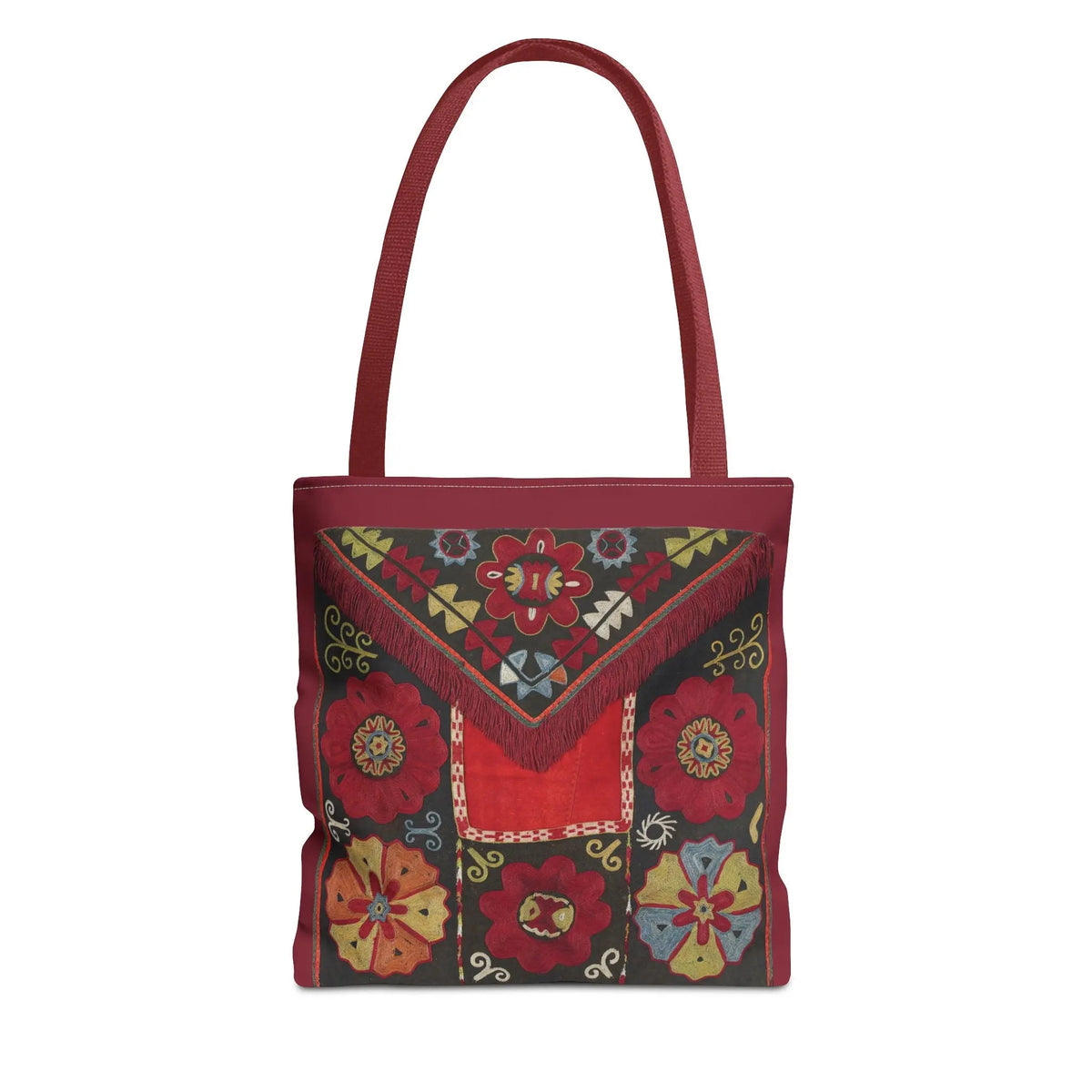  A high-end canvas tote bag featuring an intricate deep red floral Suzani embroidery pattern with vintage ethnic folk art motifs, shown in a professional product mockup.