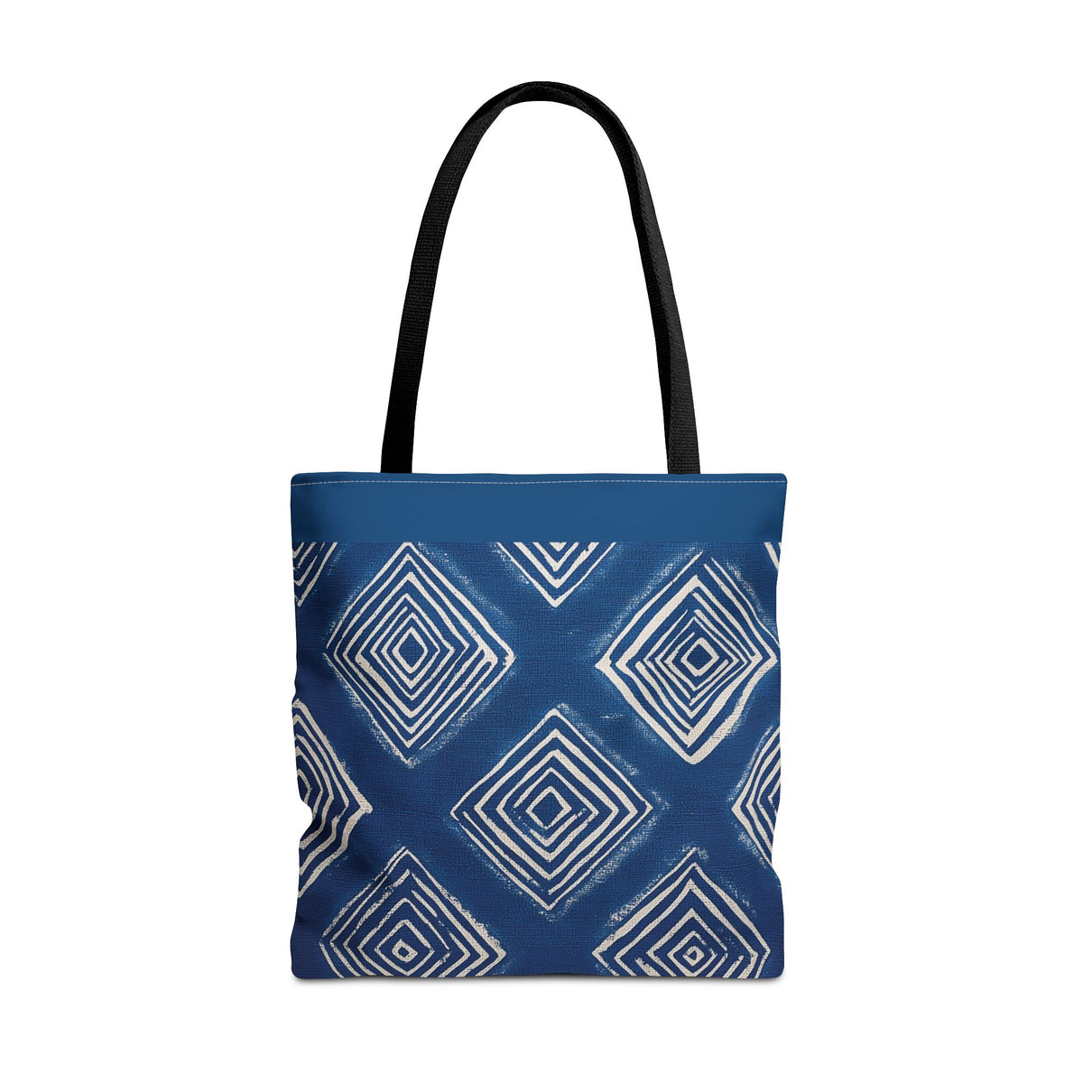  A high-quality canvas tote bag featuring an indigo and white geometric Shibori pattern, shown in a clean, professional studio setting.